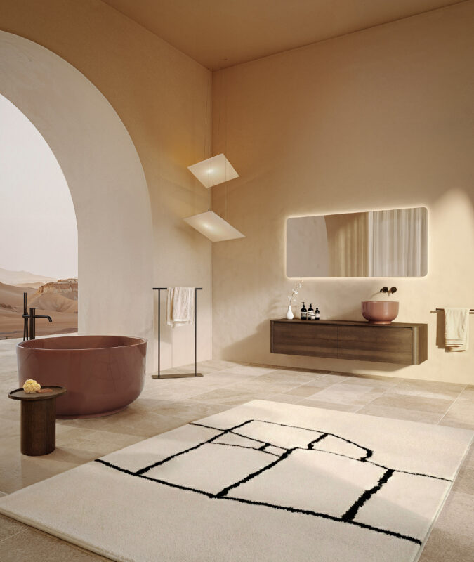 Meuble mural FUSE à 2 tiroirs, finition Chêne Sauvage Bronzé 556. Vasque à poser Origin25, finition Arcilla 191 Brillante UHS. Miroir LED FUSE. Baignoire Origin, finition Arcilla 191 Brillante UHS. Chez Hydropolis